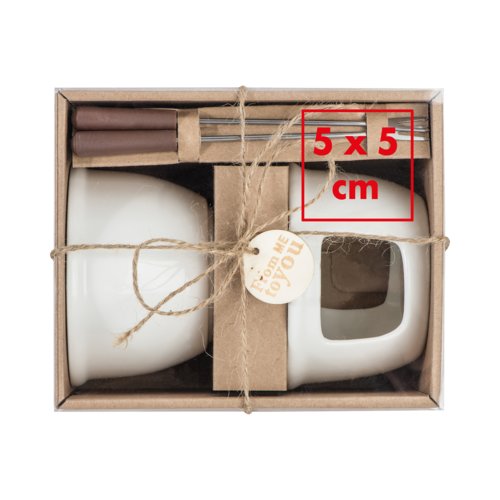 Set da fonduta di cioccolato in ceramica bianca con forchette.