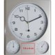Orologio da parete argentato in plastica con termometro e igrometro.