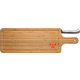 Tagliere in bamb chiaro con scanalatura e coltello.