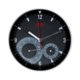 Orologio da parete nero con termometro e igrometro integrati.